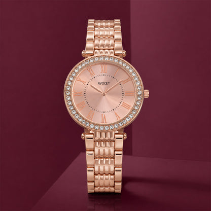 The women's rose gold watch presented on a decorative stand, emphasizing its luxurious appeal.