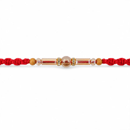 Red Braided Rakhi with Wooden Beads and a Pink Crystal Cylinder Bead