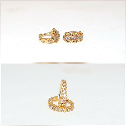 Gold plated huggie hoops with triple cubic zirconia danglers on white background