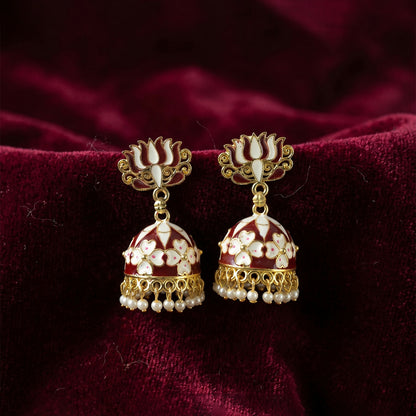 Maroon lotus jhumka earrings shown worn with ethnic attire