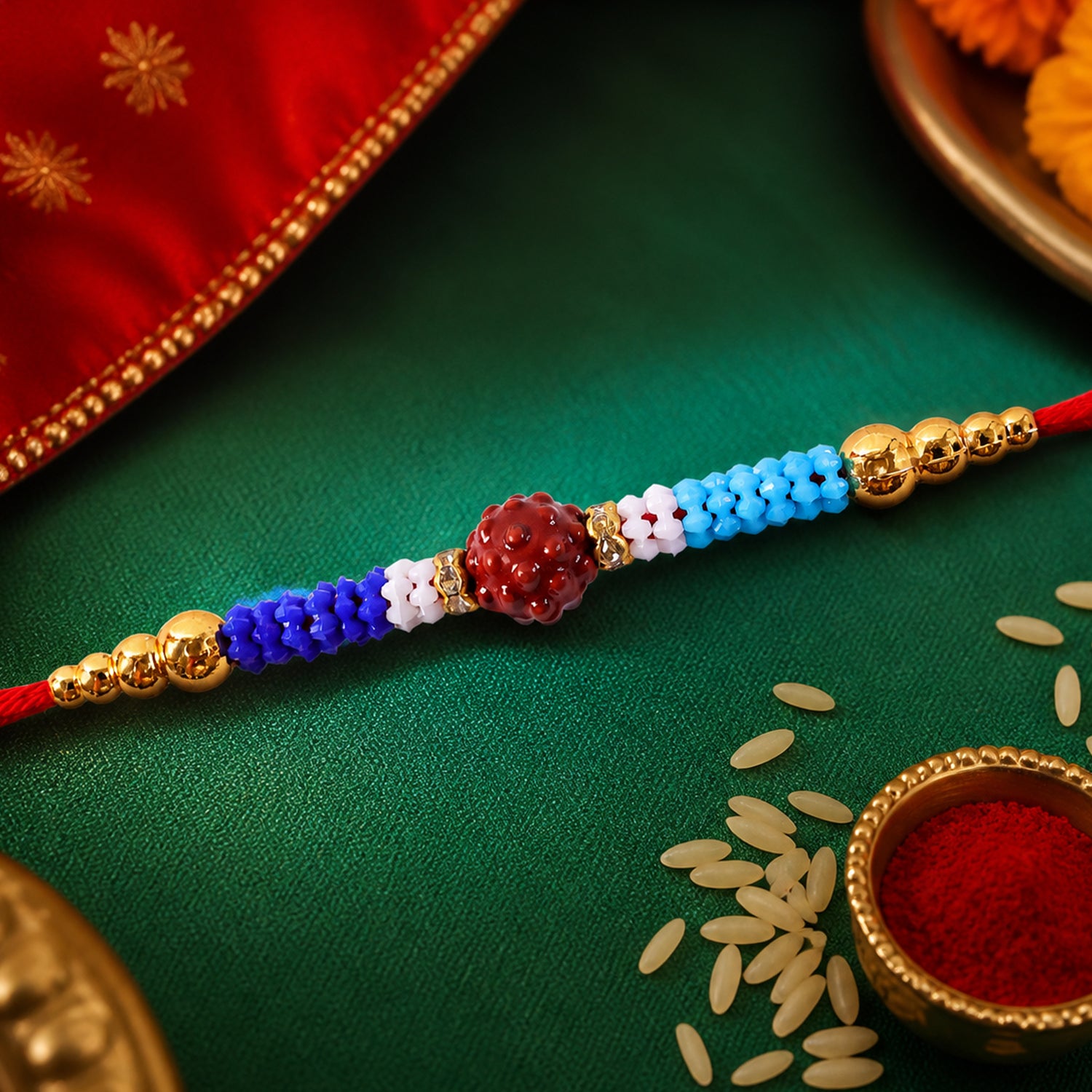 Blue Red Beaded Rakhi with Gold Accents and Classic Festive Brother Gift Appeal Ideas