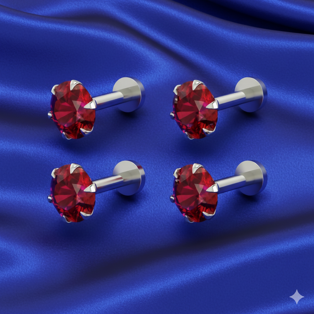Close-up of rose gold flat-back nosepin stud featuring vibrant red cubic zirconia