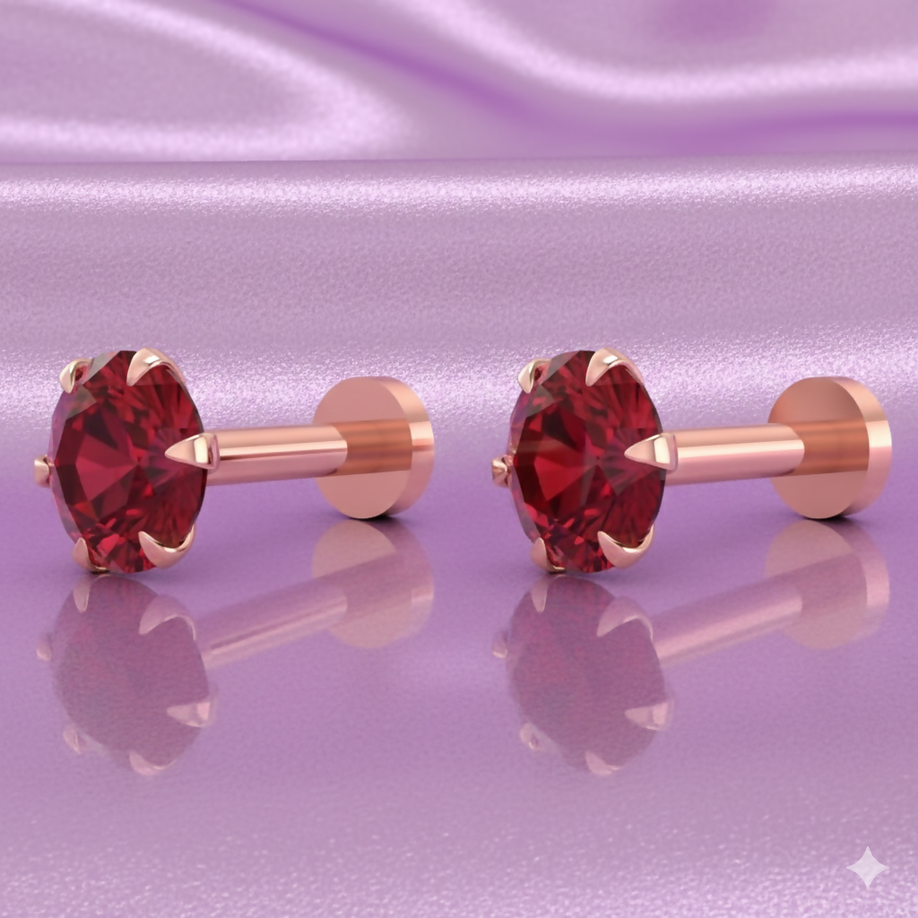 Close-up of flat back ruby red nosepin stud in rose gold