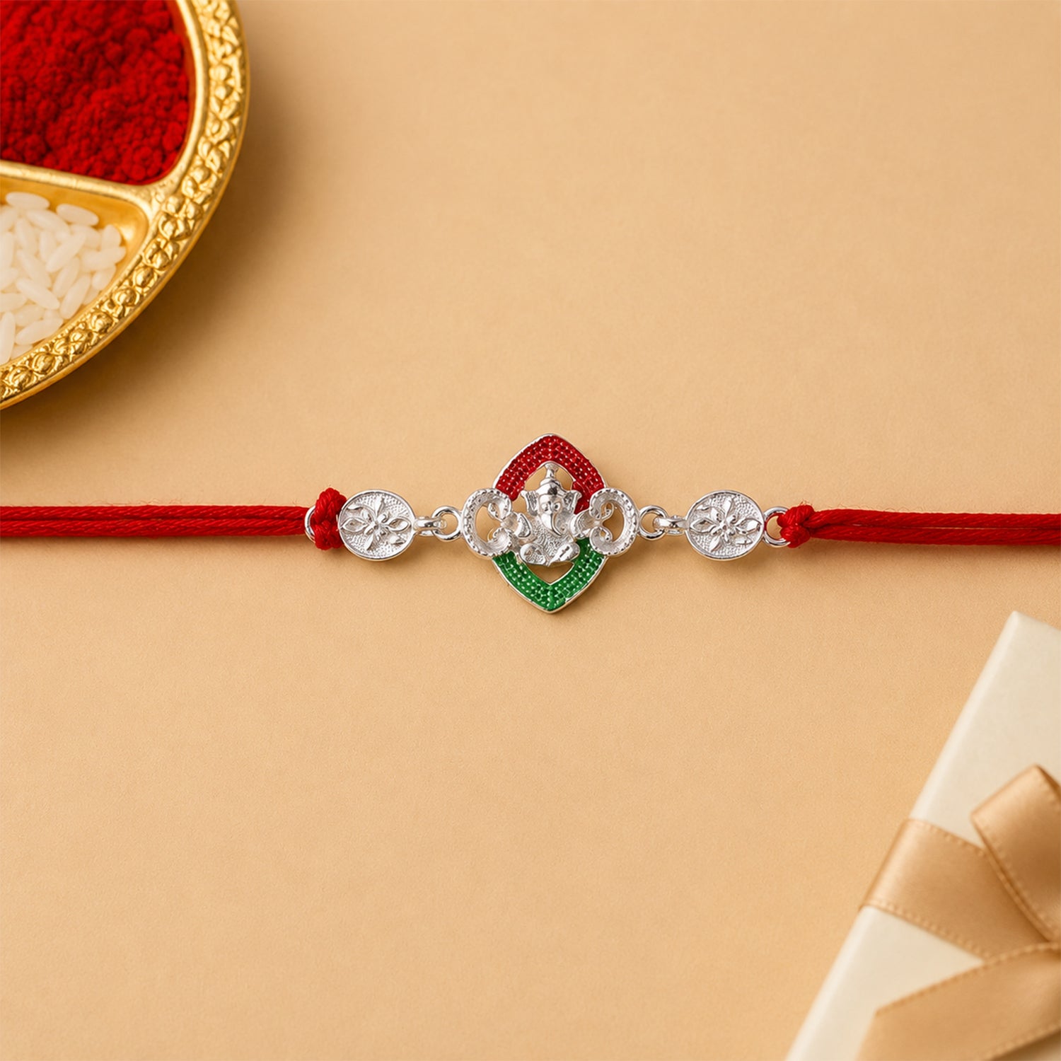 Silver Green Floral Rakhi with Red Thread and White Side Charms
