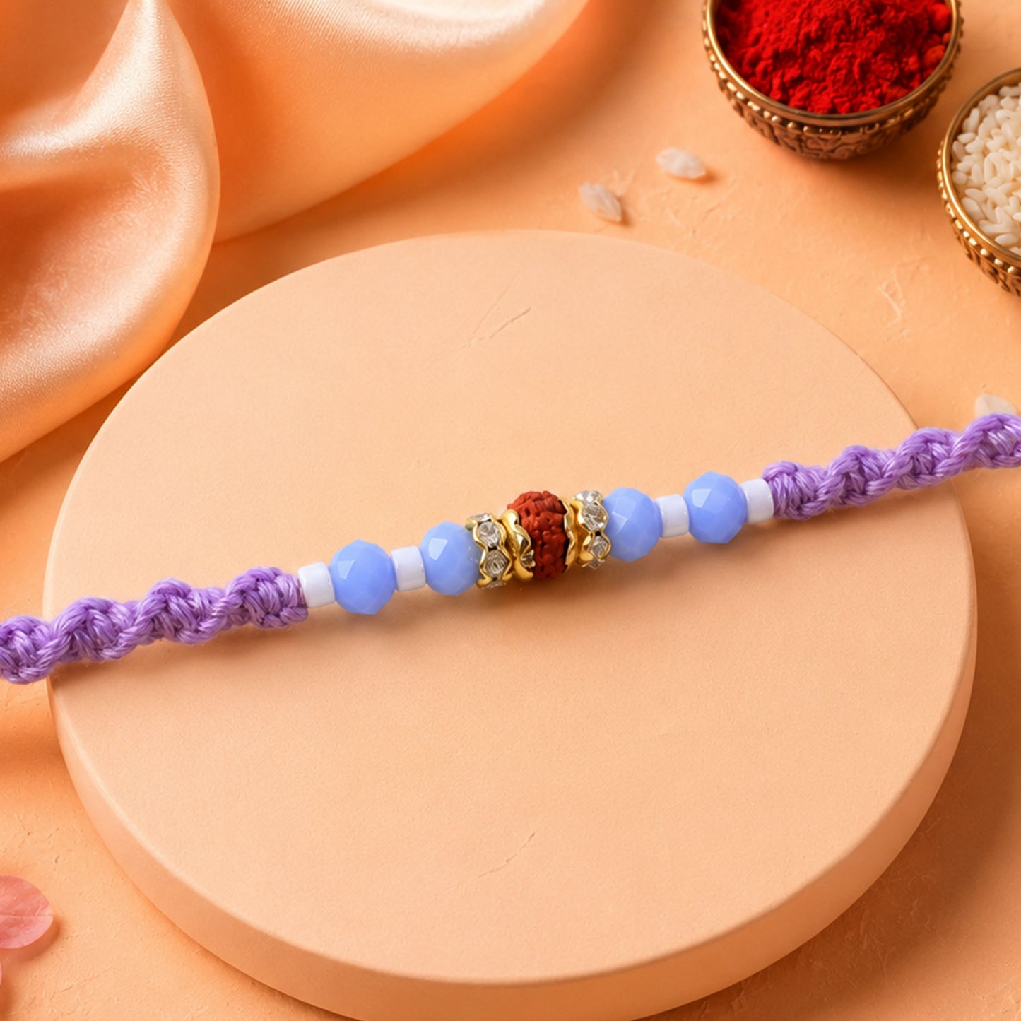 Sparkling Pearl Stone Rakhi with Colorful Thread and Premium Festive Beauty