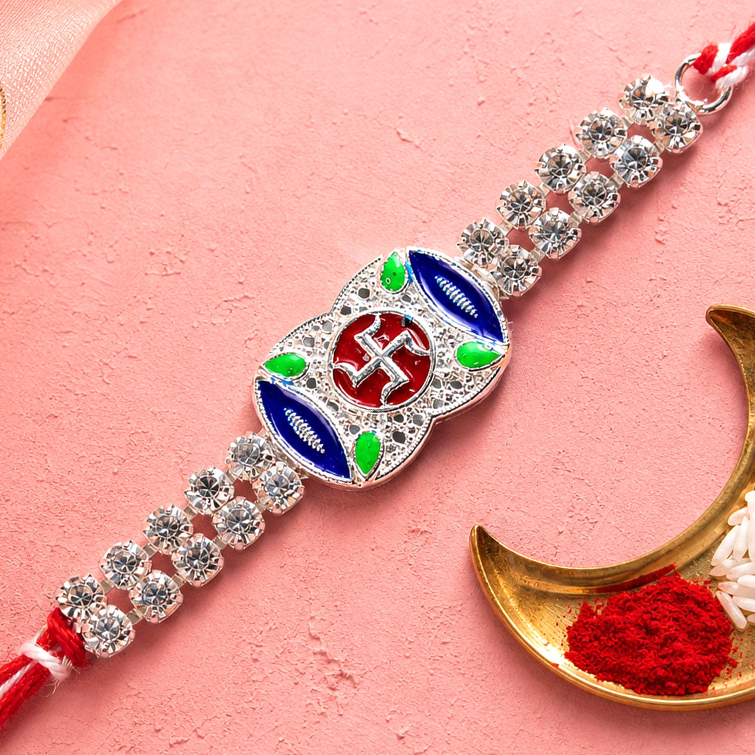 Premium Rakhi showcasing Swastik Charm, gold trims and chain look for Product Display