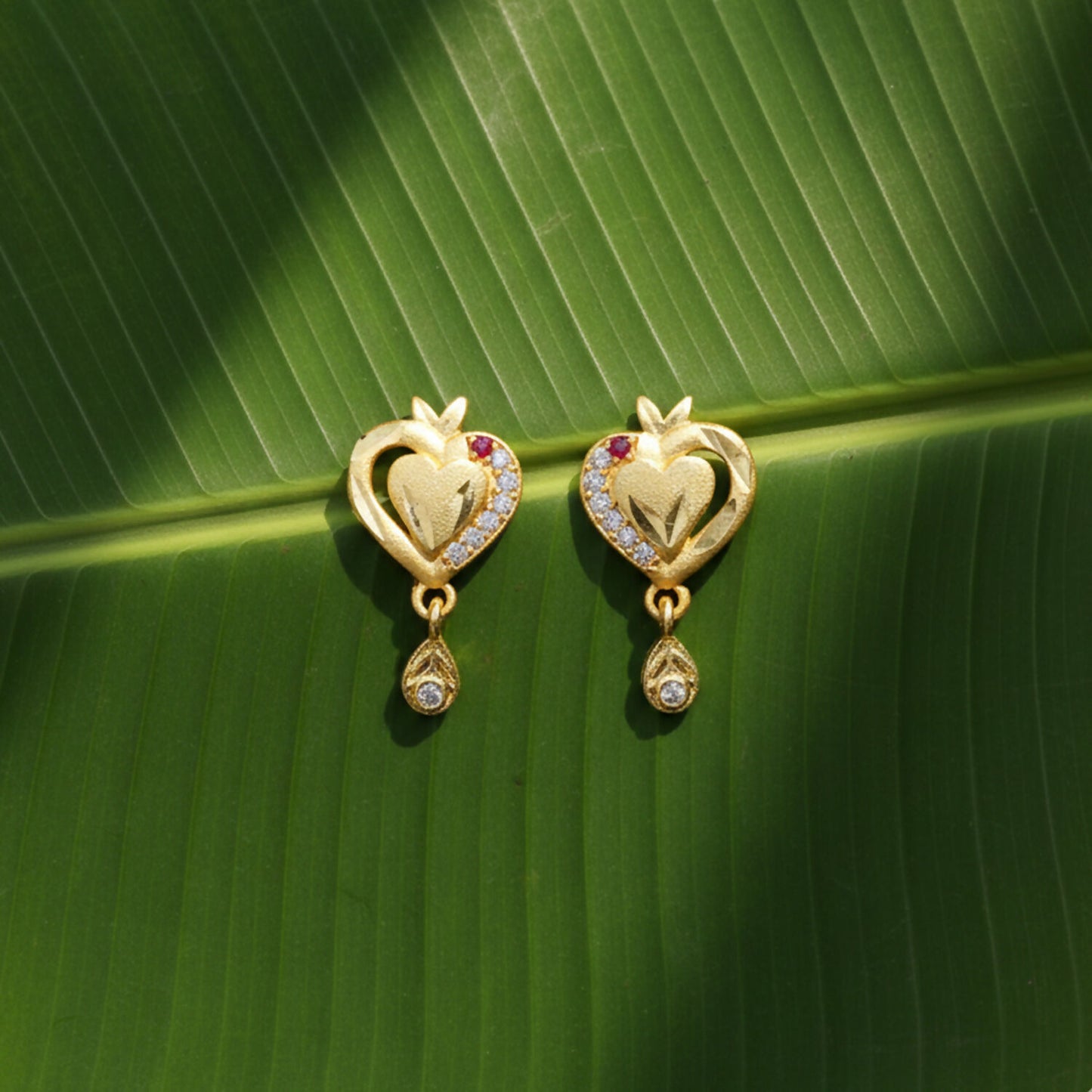 Heart Shaped Gold Finish Earrings With Crystal Border And Delicate Hanging Drop