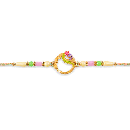 Golden Circular Rakhi with Pink Green Beads and Refined Festive Brother Gift Appeal