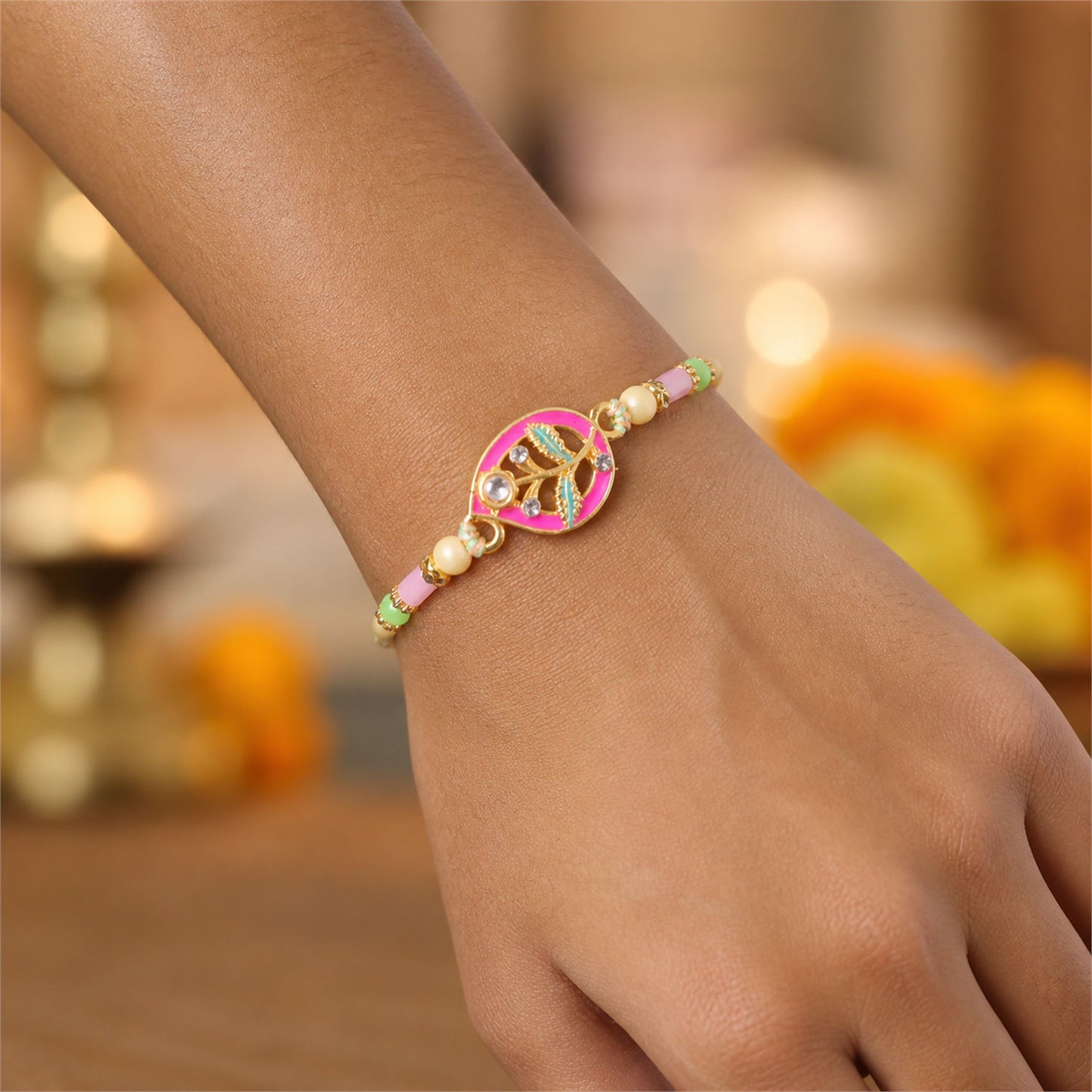Leaf Shaped Pink and Green Enamel Pendant Rakhi with Pastel Beads