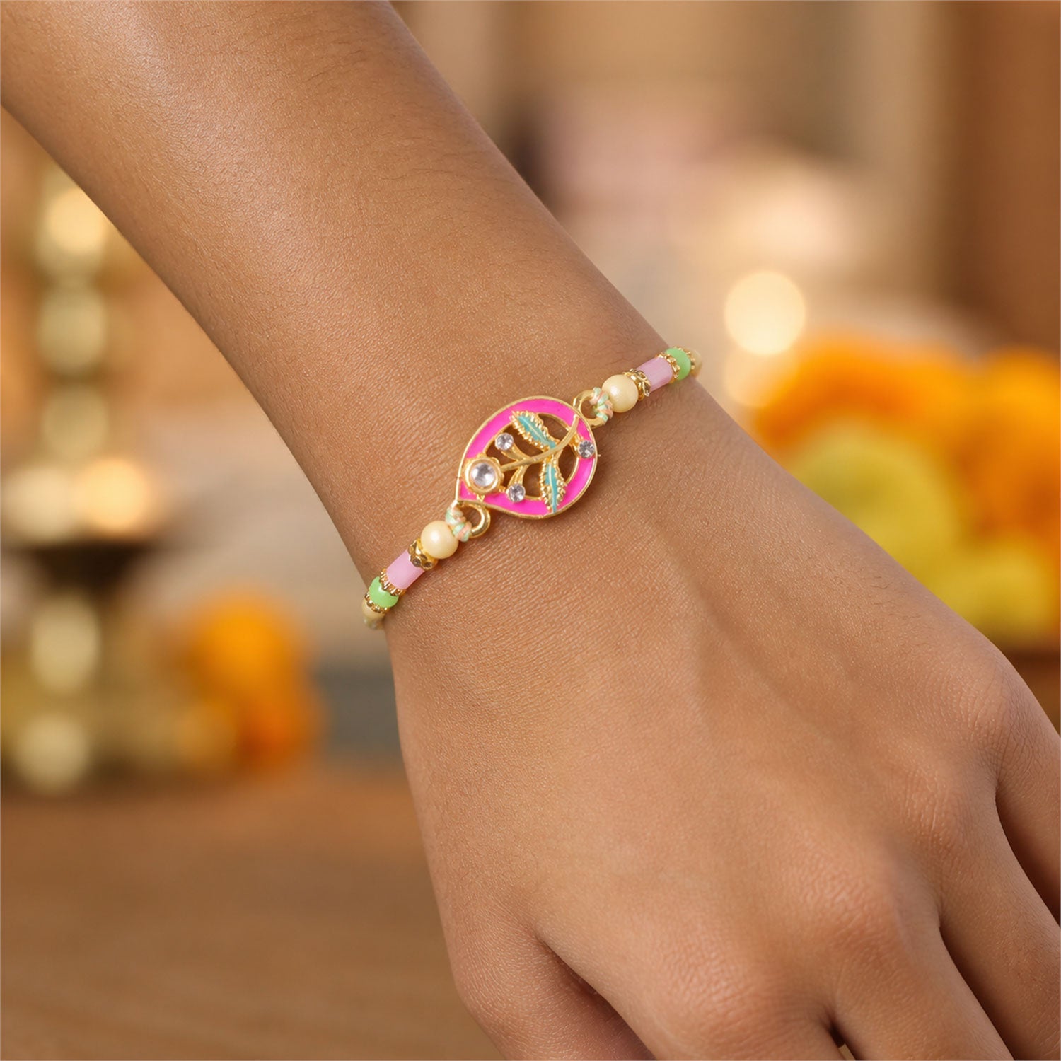 Leaf Shaped Pink and Green Enamel Pendant Rakhi with Pastel Beads