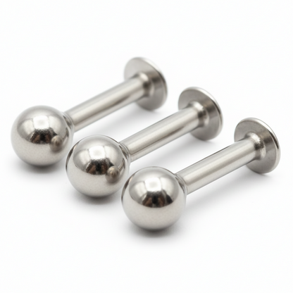 Close-up of silver plated ball labret stud earrings suitable for lip and ear piercings