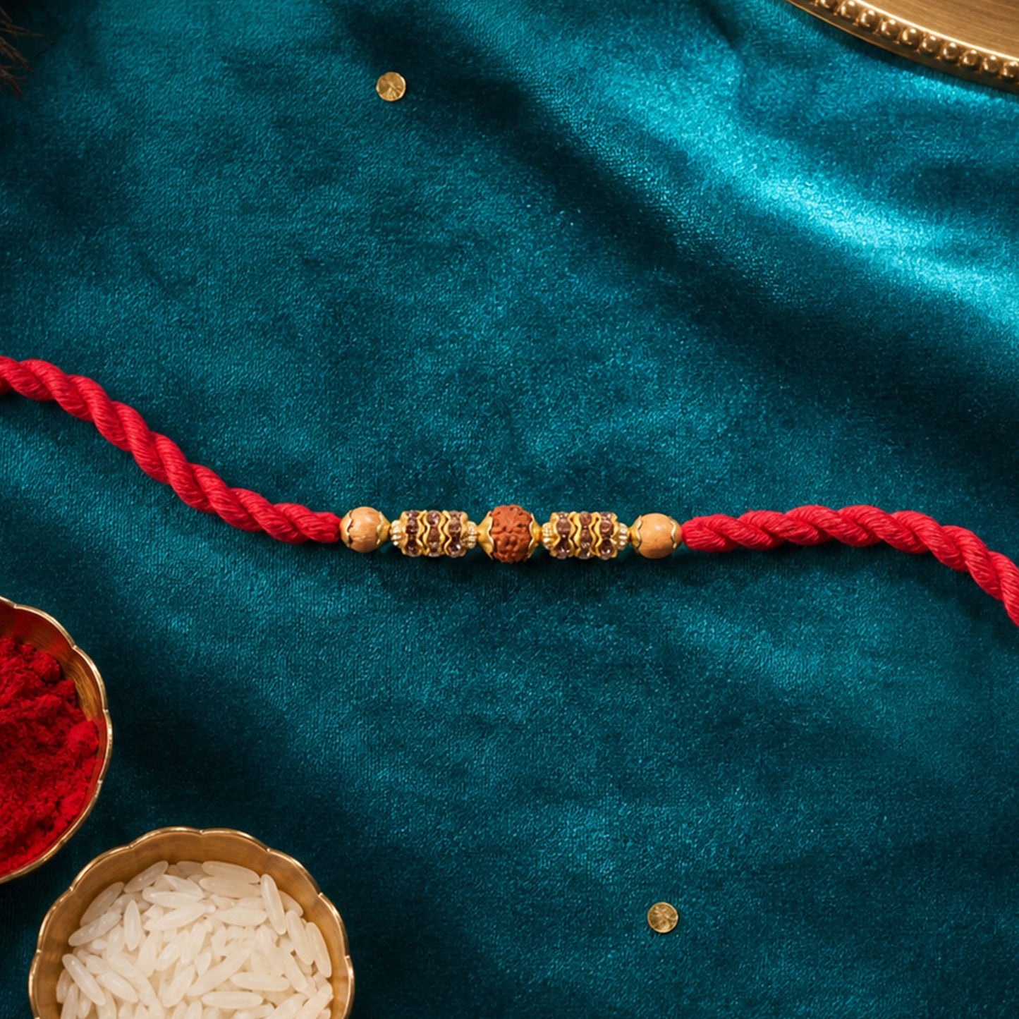 Red Thread Rakhi with Textured Golden Rudraksha-Style Bead Pendant