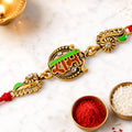 Antique Gold-Toned Ram Rakhi with Crystal Accents, Green Enamel & Designer Red Thread