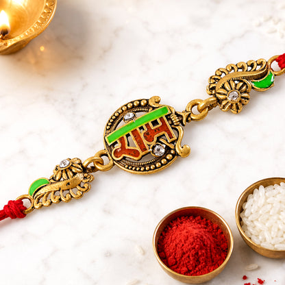 Antique Gold-Toned Ram Rakhi with Crystal Accents, Green Enamel & Designer Red Thread