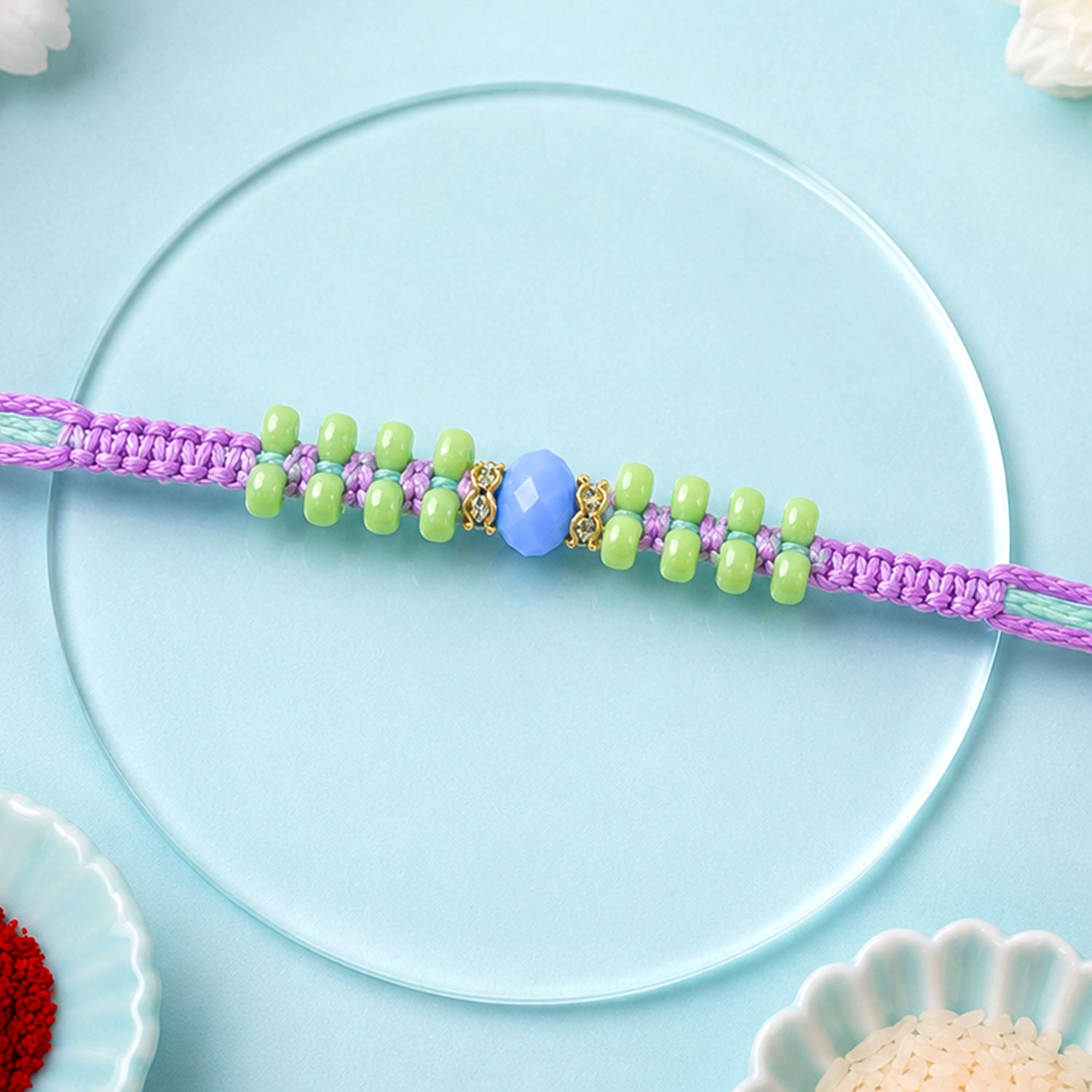 Purple Macrame Bracelet Rakhi with Green Beads, Blue Accent and Playful Thread