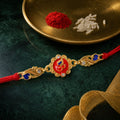 Premium Rakhi featuring Om Plaque, gold trims and chain look for Festive Display