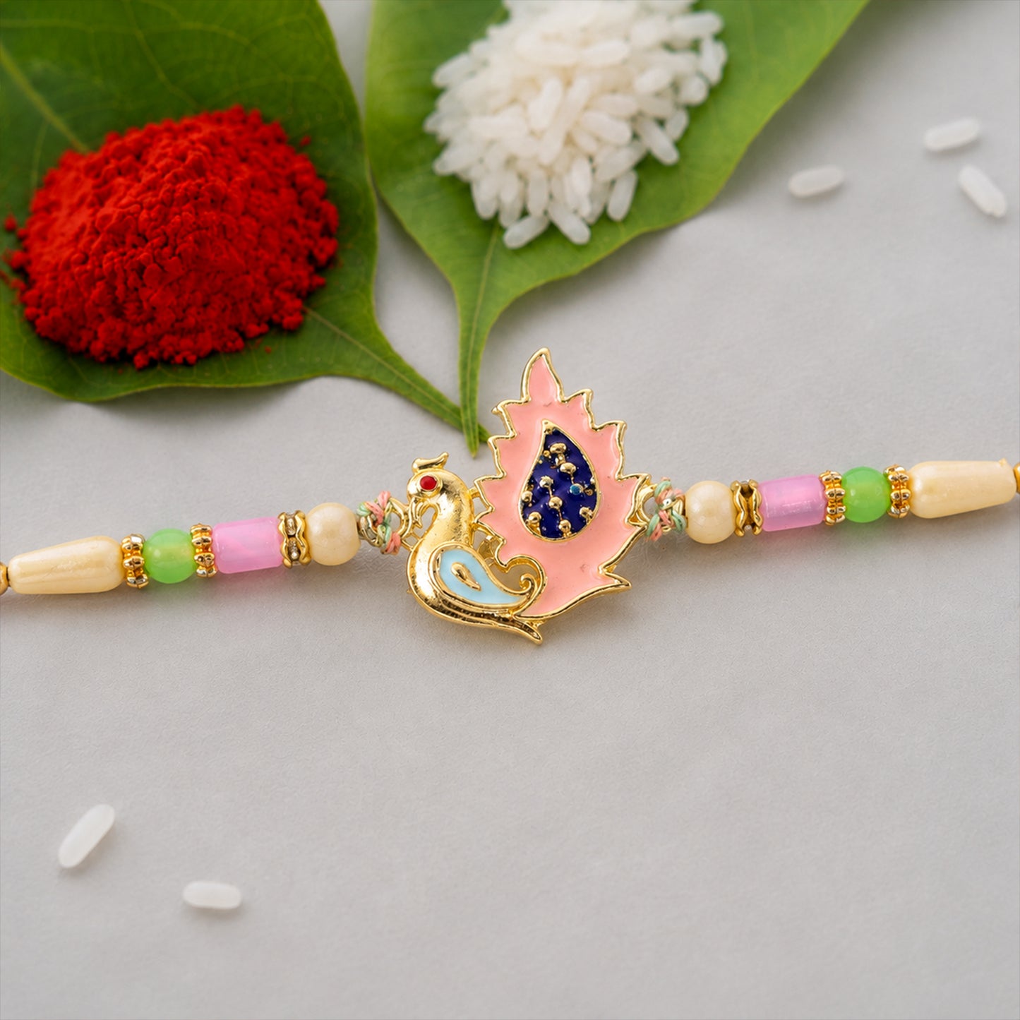 Peacock Designer Rakhi for Brother with Pink Pendant & Colorful Bead Work