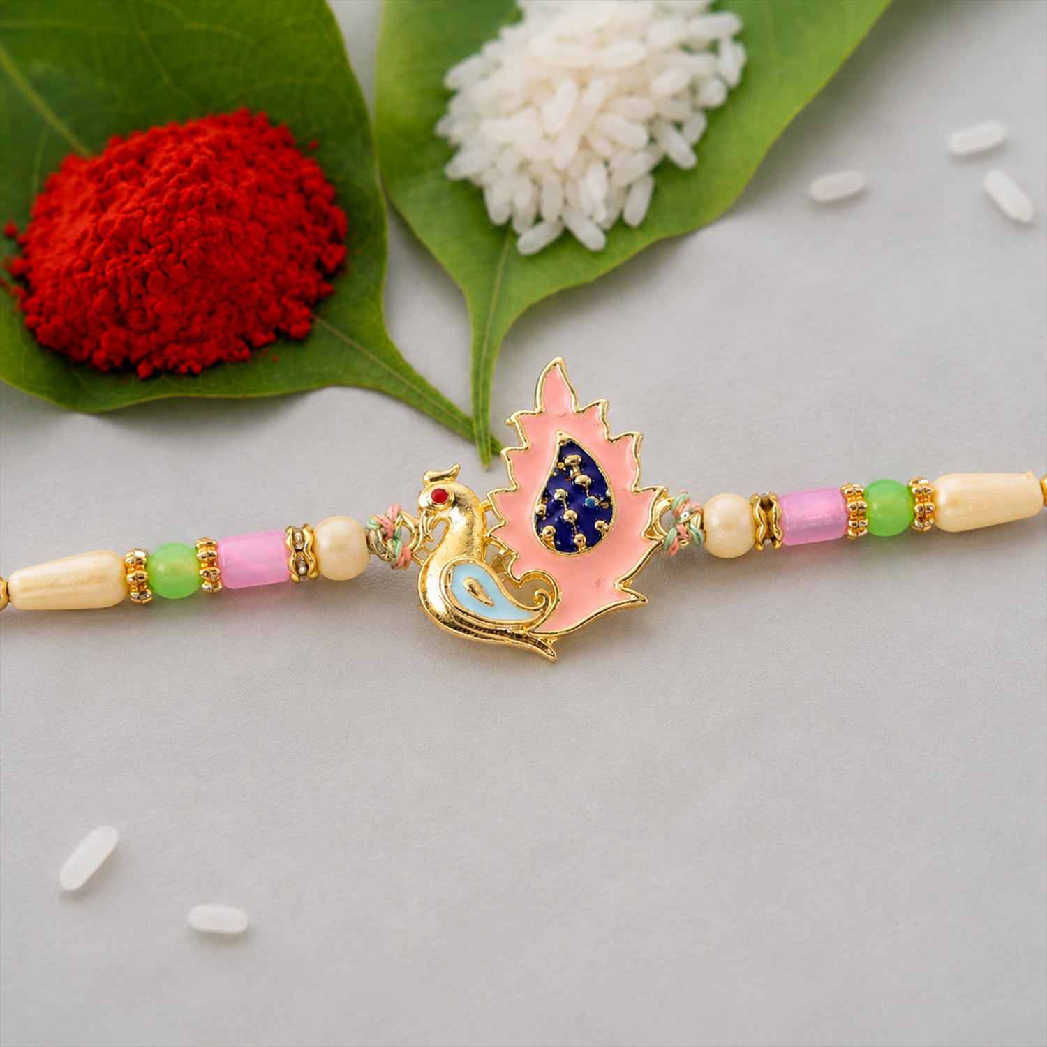 Peacock Designer Rakhi for Brother with Pink Pendant & Colorful Bead Work