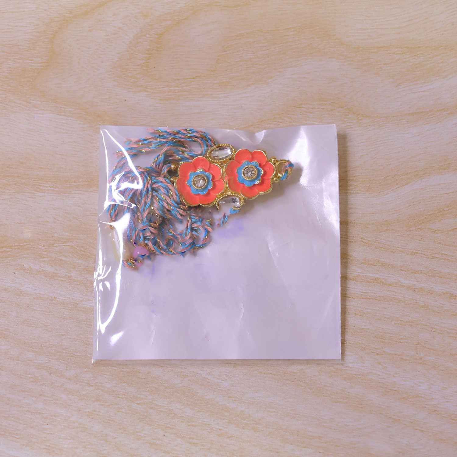 Ornate Rakhi with Butterfly Bloom Charm, multicolor stones and bead line for Gift Use