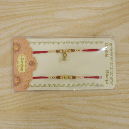 Bhai Bhabhi Kundan Rakhi Set with Red Thread, Gold Beads and Pearl Drop Accent Design