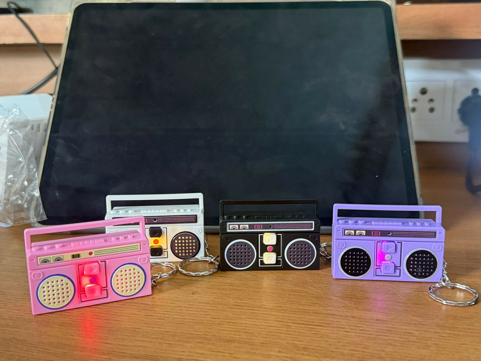 Mini voice recorder keychain with retro radio design in hand