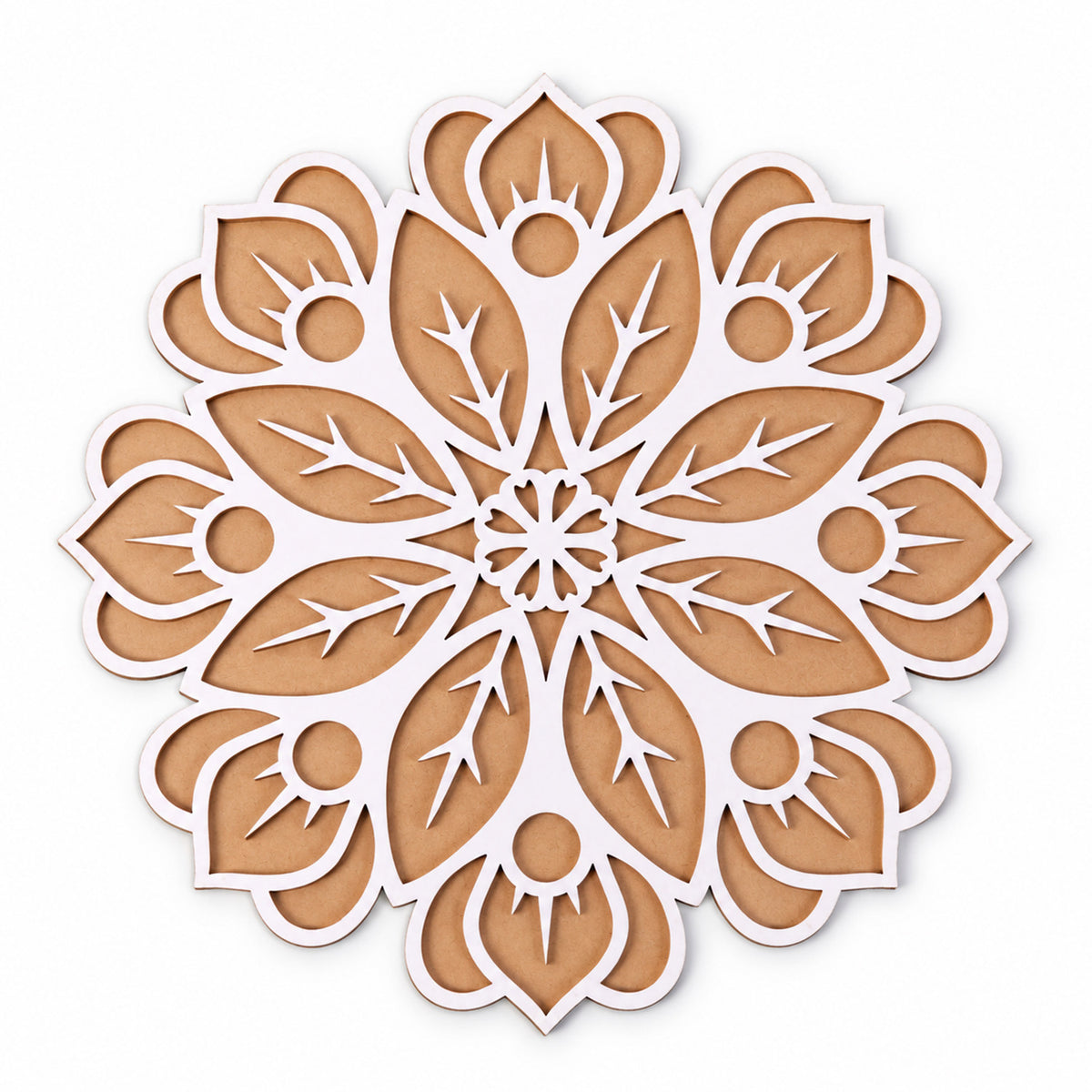 A close-up, top-down view of the intricate white and brown wooden rangoli stencil on a plain white background.