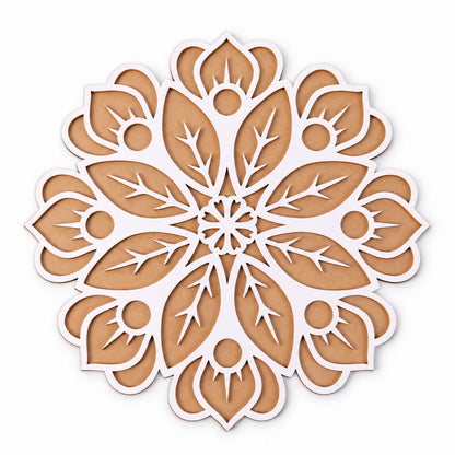 A close-up, top-down view of the intricate white and brown wooden rangoli stencil on a plain white background.