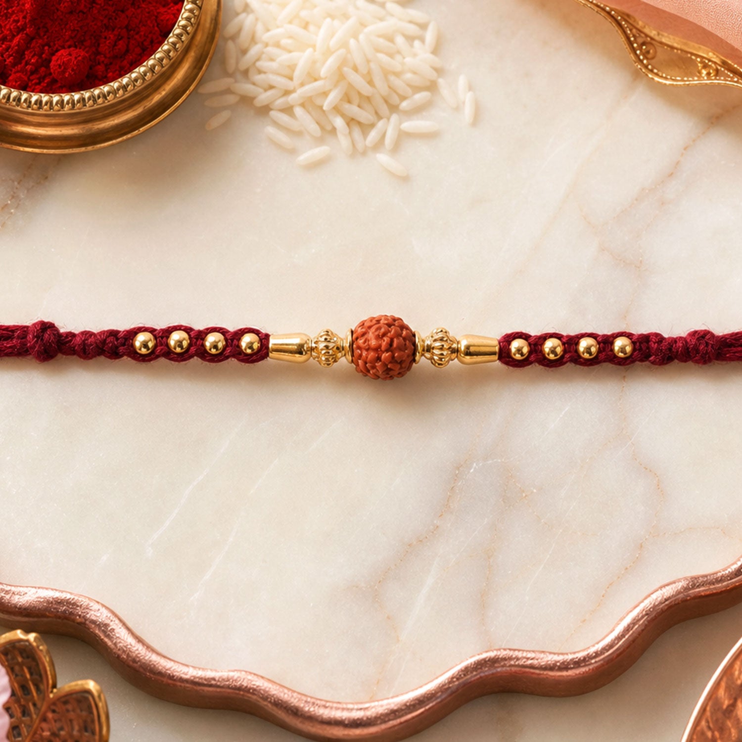 Red Braided Rakhi with a Rudraksha Bead and Wooden Bead Accents
