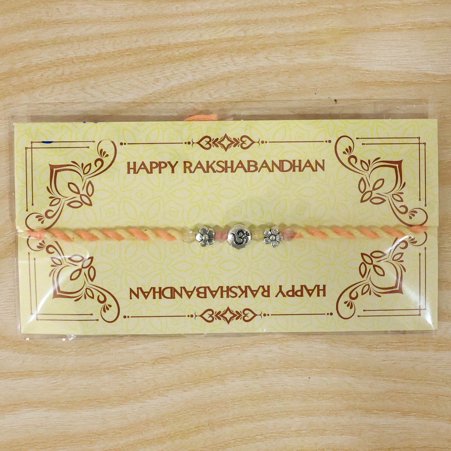 Graceful Pastel Bracelet Rakhi with Silver Centre and Delicate Raksha Bandhan Beauty