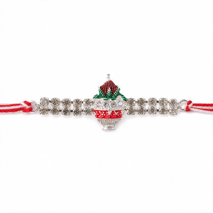 Festive Rakhi showcasing Kalash Charm, leaf detail and wrist style for Festive Use