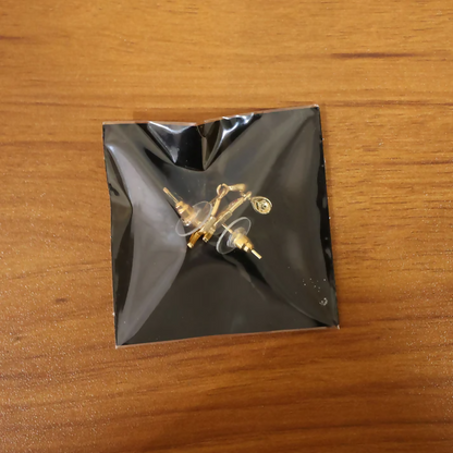 Luxury Curved Gold Earrings With Sparkling Stone Inlay And Elegant Drop Design