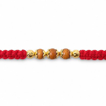 Red Braided Rakhi with Natural Wooden Bead Pendant Accents