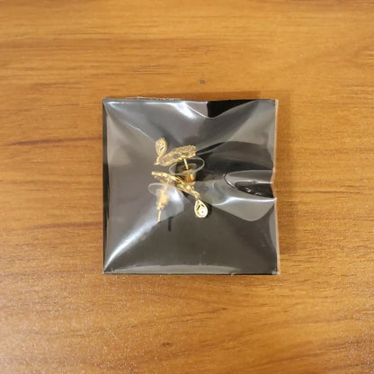 Elegant Gold Finish Leaf Pattern Stud Earrings With Sparkling Stone Drop Design