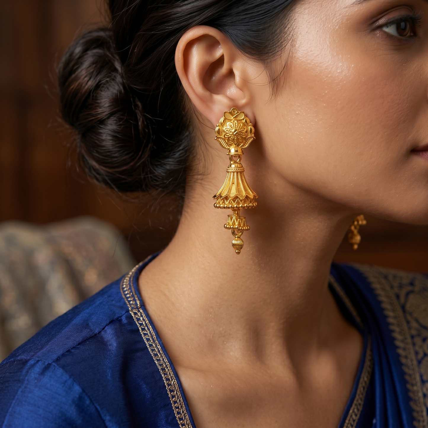 Close-up of traditional gold plated jhumki earrings