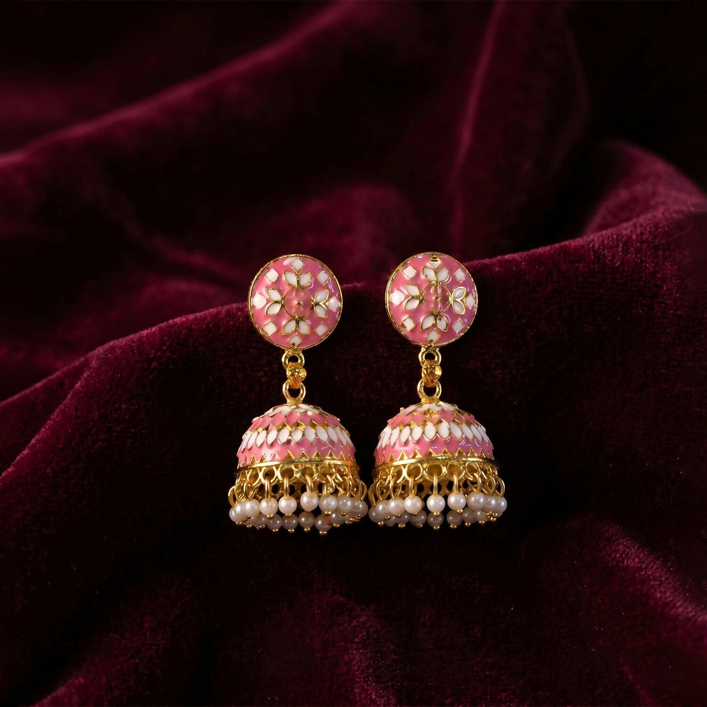 Golden finish border and pink dome design on jhumka earrings