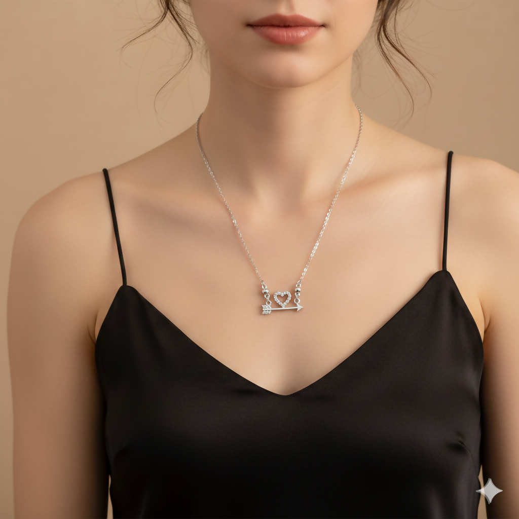 Close-up of silver plated Heart & Arrow pendant showcasing crystal heart on silver-tone arrow