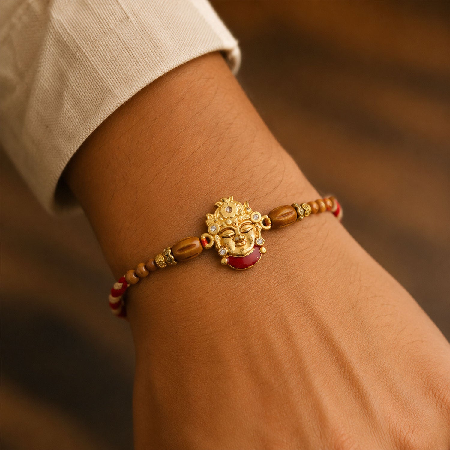 Golden Shrinathji Face Rakhi with Crown Detail, Roli Chawal Coin and Velvet Style Gift Packing