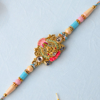 Gold Peacock Kundan Pendant Rakhi with Pastel Beads