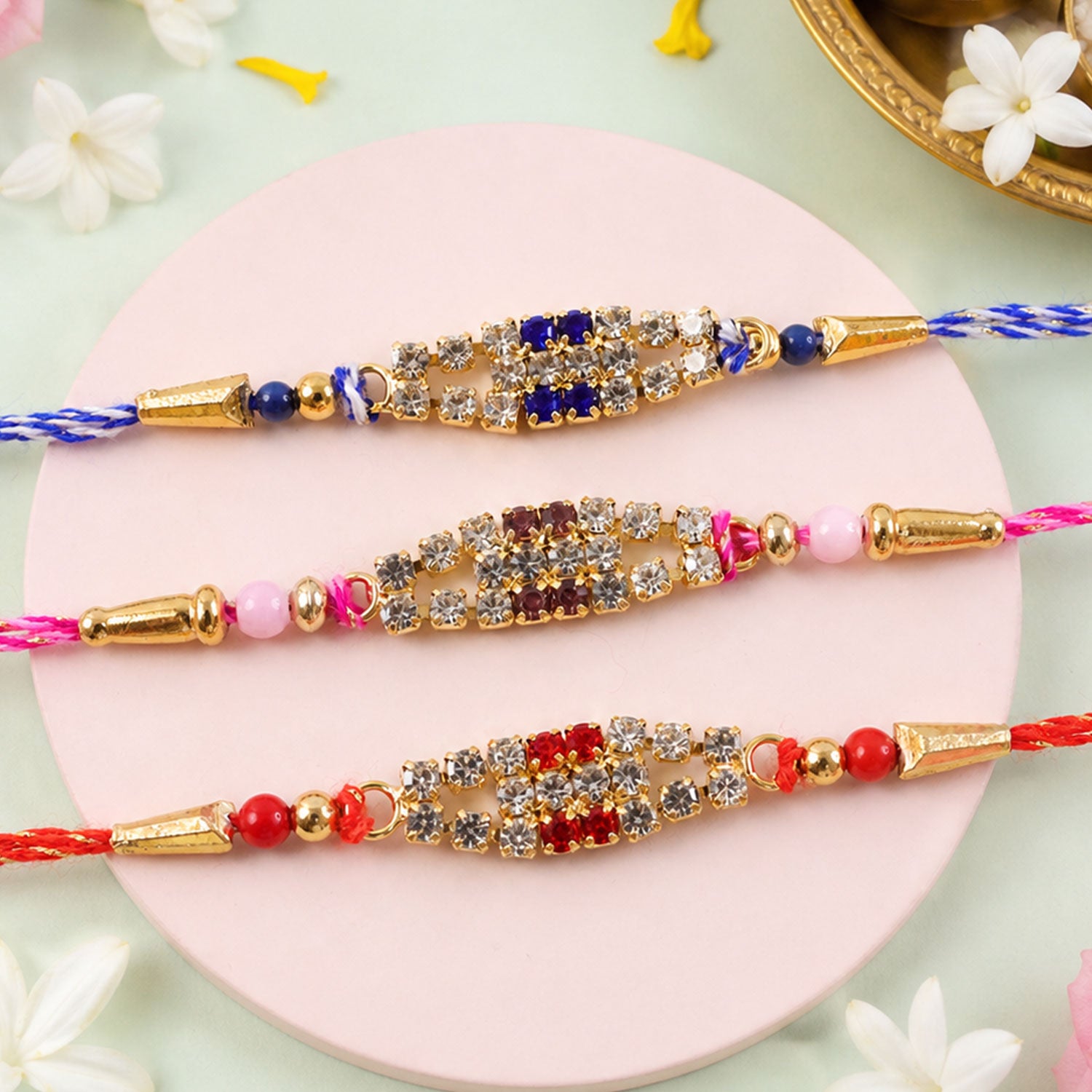 Long Oval Centre Motif Rakhi in Mix Colour Threads (Pack of 6)
