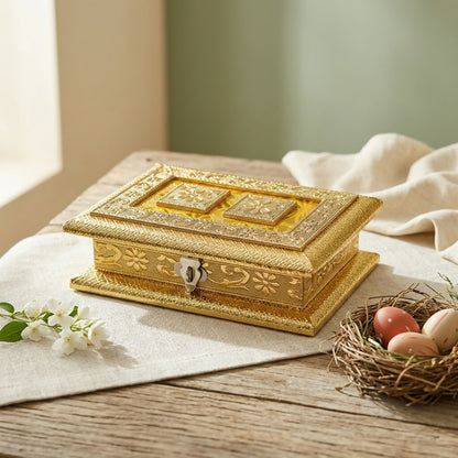 Side angle of handcrafted golden floral jewelry box with pedestal base