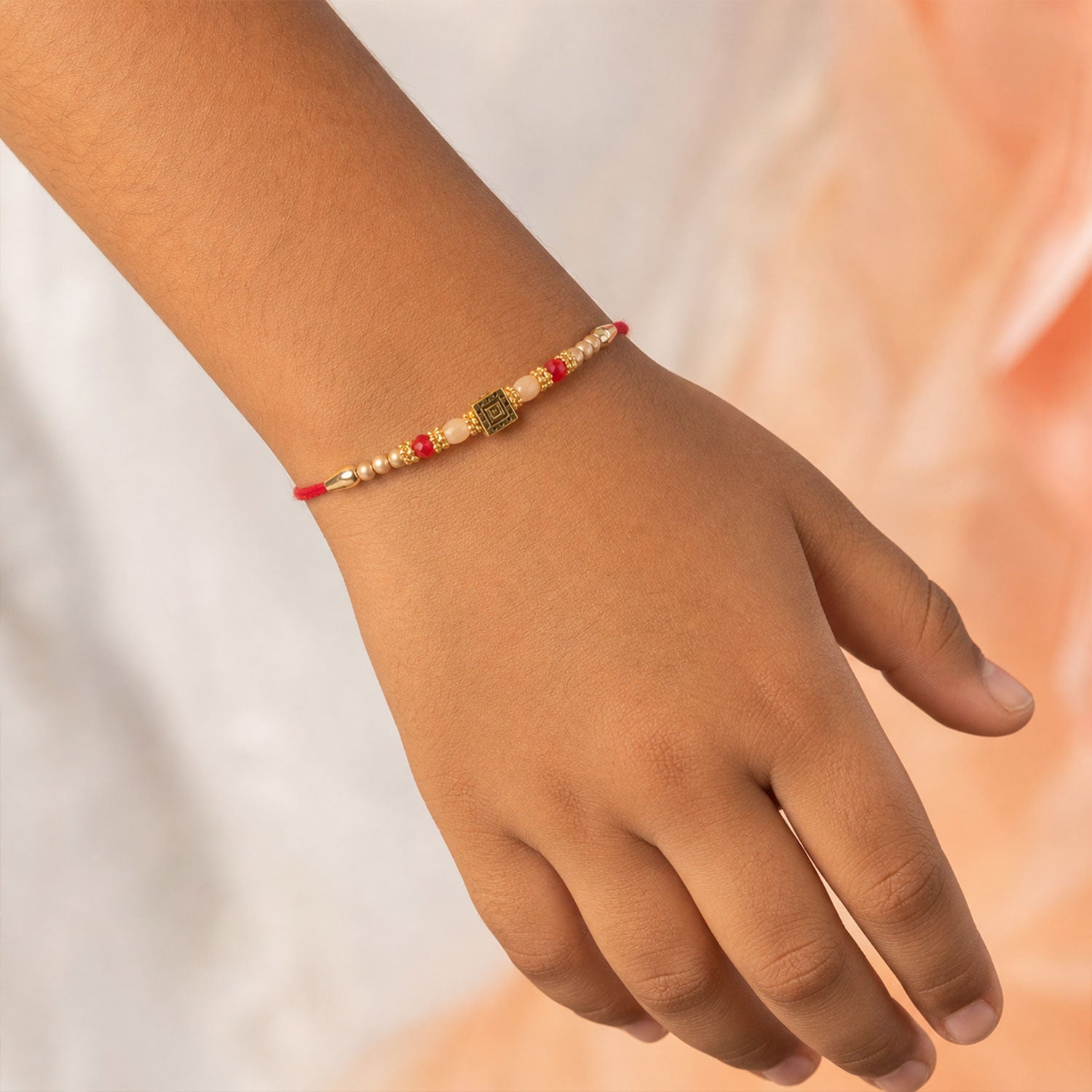 Graceful Circular Medallion Bhai Bhabhi Rakhi with Oval Pendant for Festive Gifting