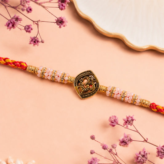 Silver Tone Designer Rakhi with pastel beads and elegant bracelet style finish.
