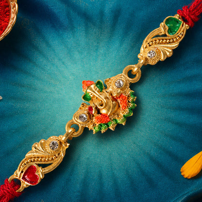 Gold-Toned Lord Ganesha Rakhi with Orange-Green Enamel, Crystal Accents & Red Thread