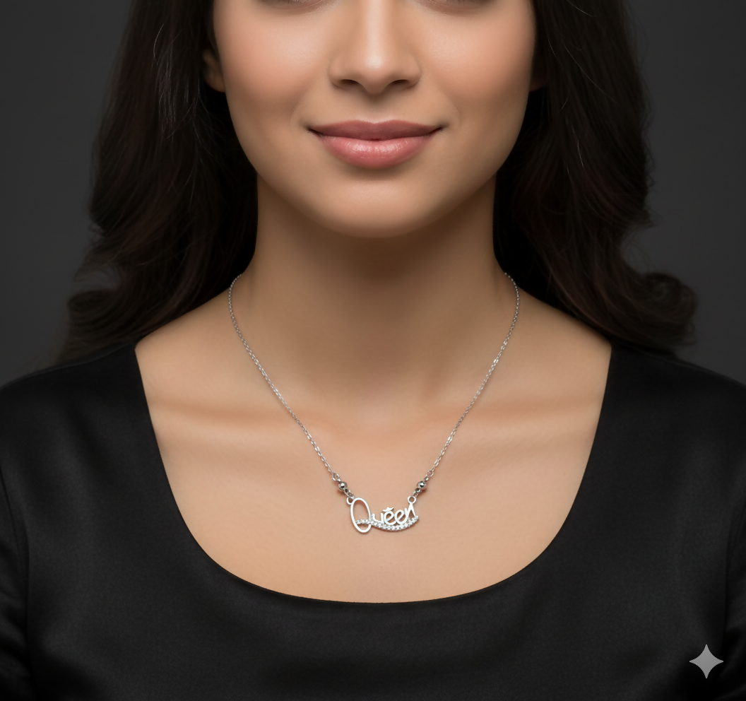 Elegant silver tone Queen pendant necklace with polished bead accents near the pendant