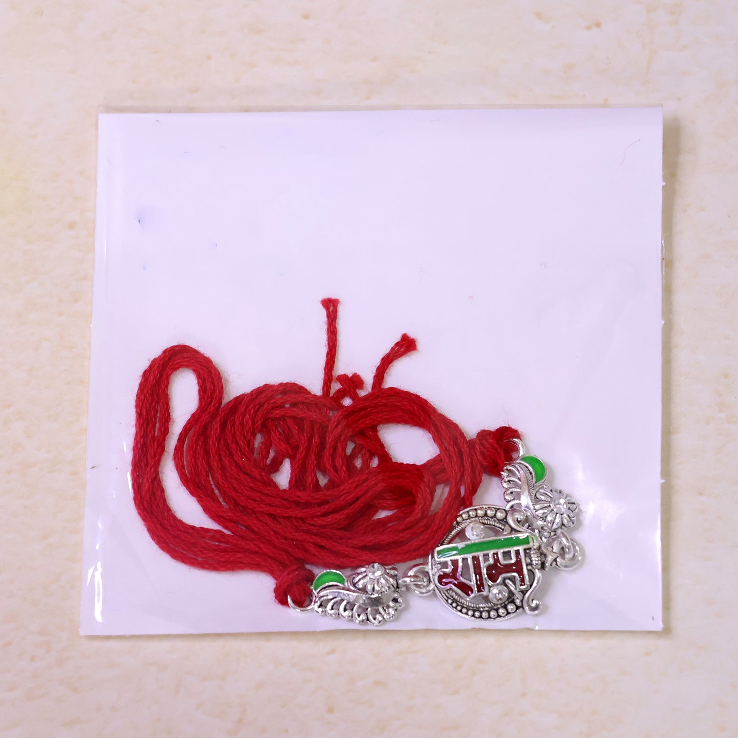 Silver-Toned Ram Rakhi with Red & Green Enamel and Crystal Accents for Brother