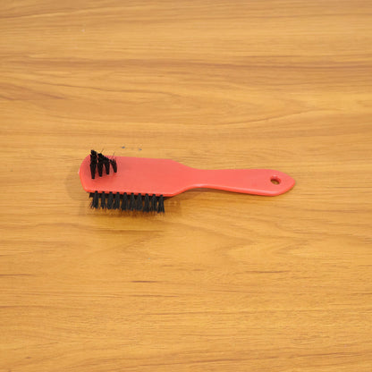 Shoe cleaning brush in use on sneakers