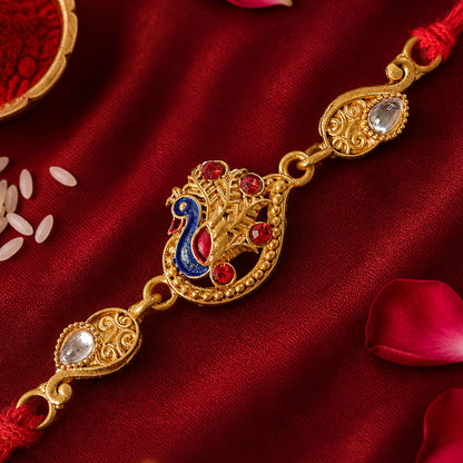 Festive Rakhi featuring Peacock Charm, pink accents and wrist style for Gift Styling