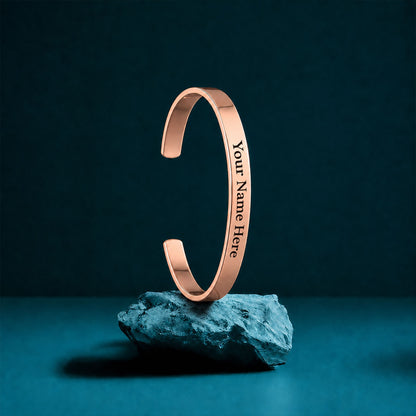Close up of custom engraved rose gold kada for men.