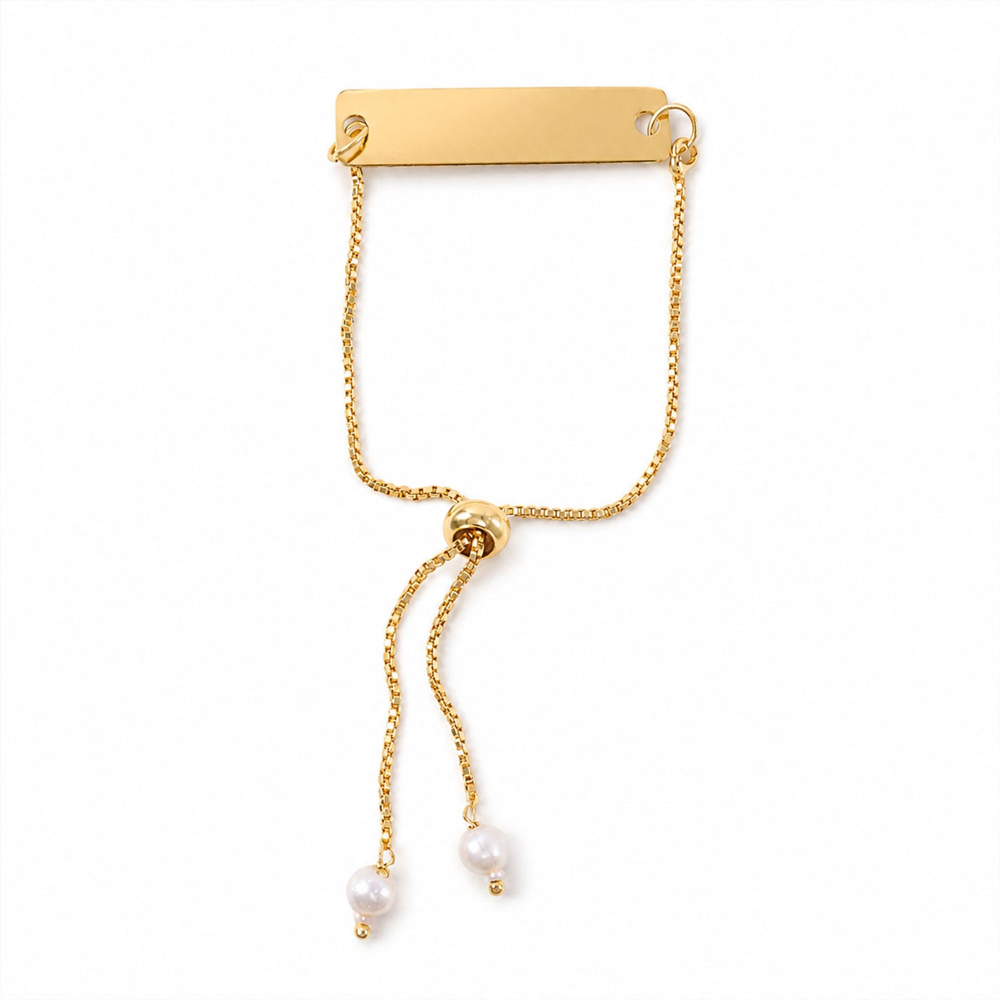 Gold tone custom name bracelet with pearl beads, laid flat for detailed view.