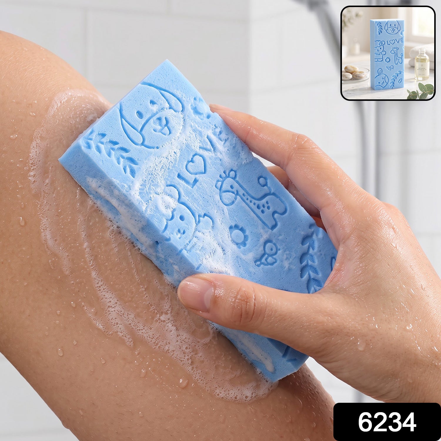 A hand holds a blue exfoliating sponge with animal patterns, scrubbing a leg with soap suds.